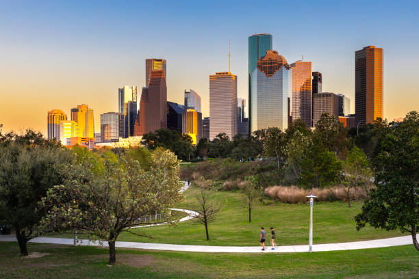 houston downtown modern business city with skyscraper city scape with park view from buffalo bayou center of houston city, texas, united states of america, us at sunset time - houston-texas bildbanksfoton och bilder