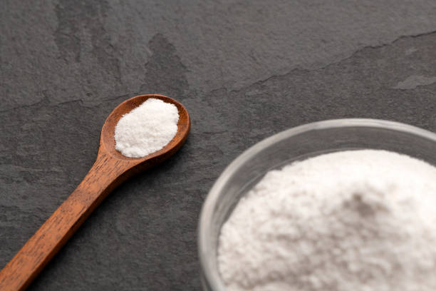 istock Baking soda in spoon and bowl - Healthy food. 2192060154