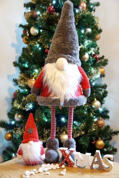 istock Big and small Christmas elves with Christmas decoration 2192063661