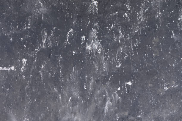 istock Dark textured surface reveals intricate patterns of wear and use in a creative workspace environment 2192068228