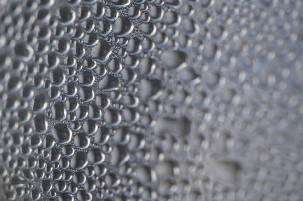 Water drops on blue glass background
