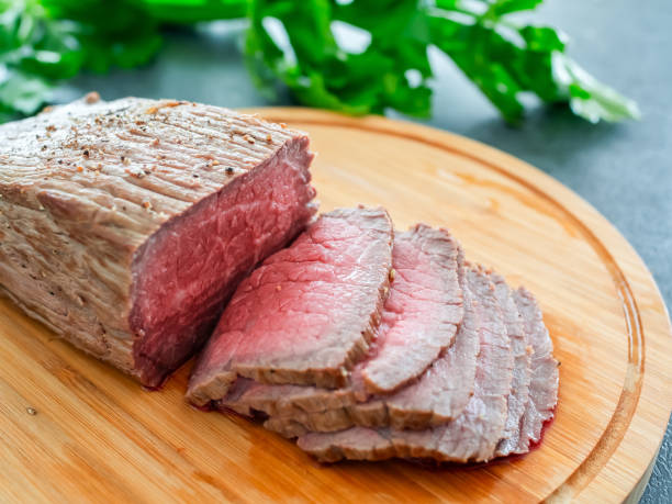 istock Roast beef on a wooden board 2192071694