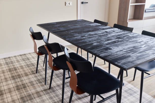 A Modern Dining Table Accompanied by Stylish Black Chairs in a Contemporary Interior Space