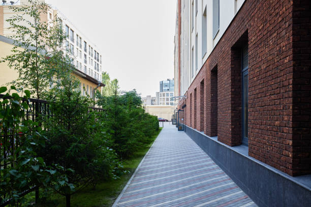 istock A modern urban pathway enriched with vibrant greenery and beautiful brick architecture 2192074779