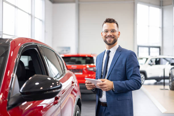 istock Salesman in a dealership with a digital tablet 2192076360