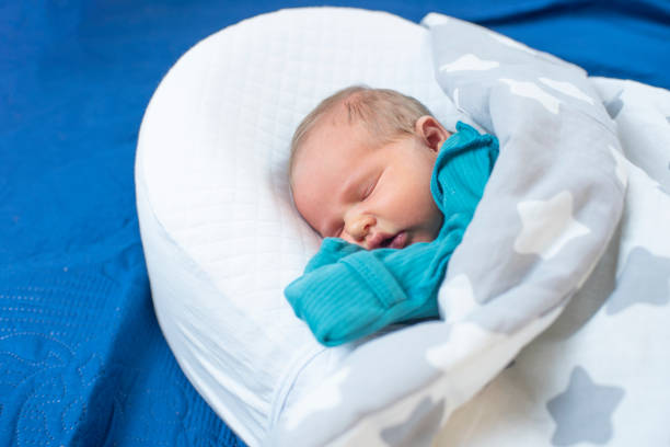 istock Newborn baby, 4 days old, sleeping. 2192076566