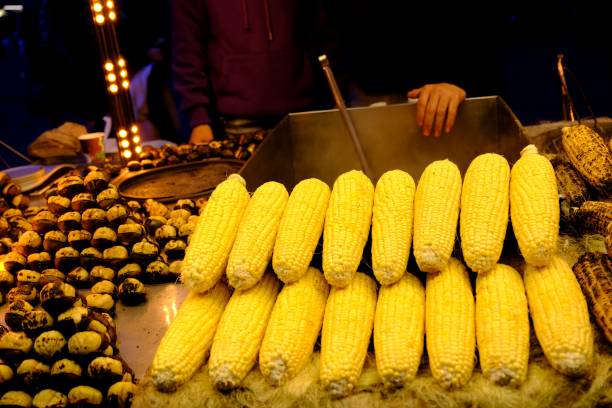 istock Boiled and roasted corn sold by a street vendor on a winter night. 2192078549