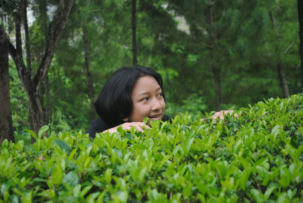 istock Smiling girl is enjoying a tea plantation. 2192084591