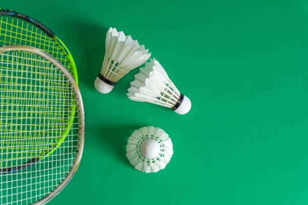 istock Badminton rackets and shuttlecocks on green background. copy space 2192085188