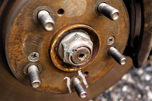 Close up of lock nut of front axle shaft in the vehicle engine powertrain system , Automotive parts concept