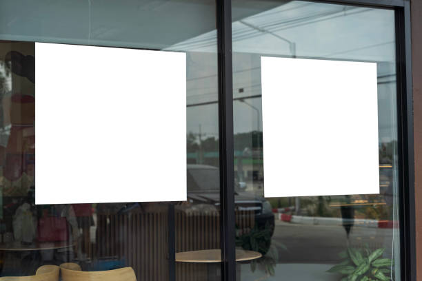 istock Mockup white poster with black frame stand in front of blur restaurant cafe background for show or present promotion product . 2192087677