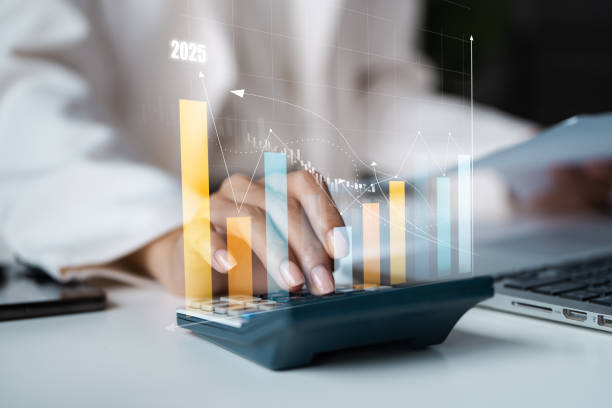 istock Business Professional Analyzing Financial Data with Calculator and Graphs for Future Growth and Success in 2025 2192087829