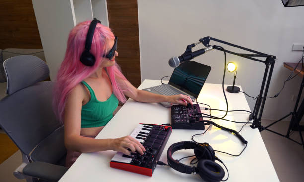 istock Beautiful young singer and musician broadcast from her home studio 2192090430