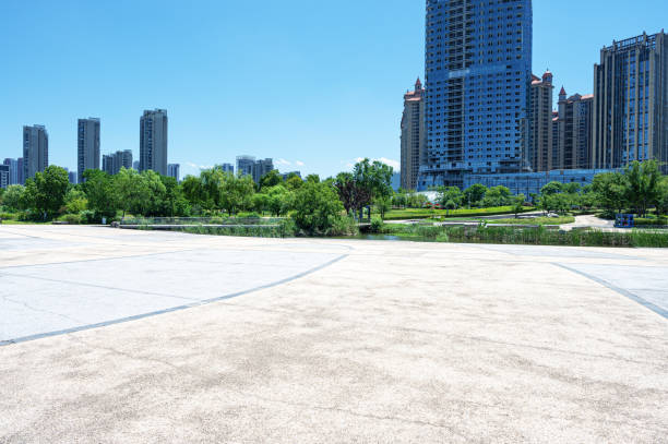 istock Empty square floor with modern urban skyline and sunny blue sky background 2192091248