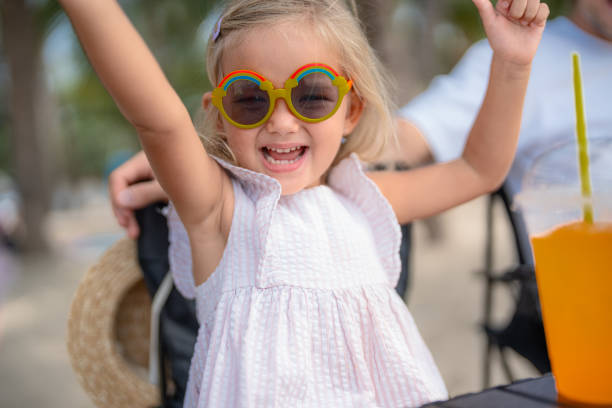 Happy little girl at summer beach. Smiling in summer vacation.
