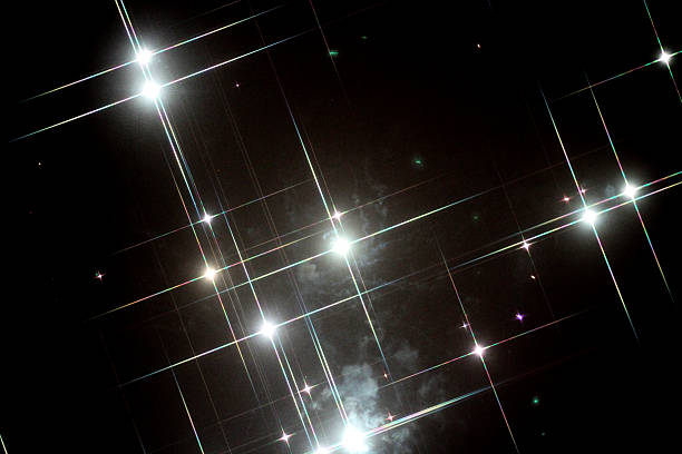 Star shaped white fireworks on a dark night sky