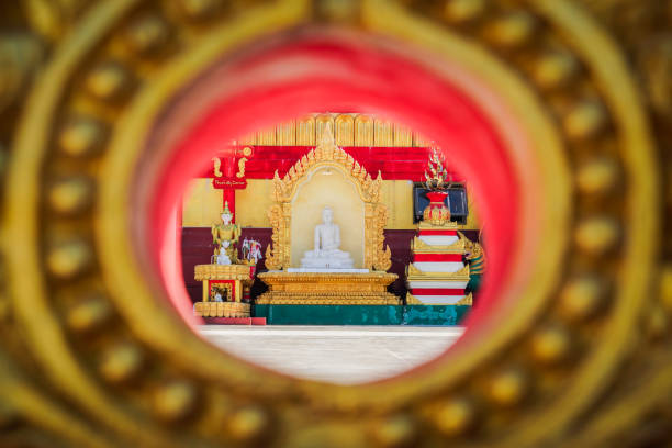 the buddha statue in the temple with dramatic tone