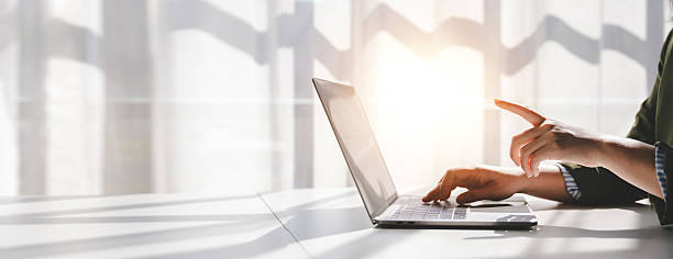 istock Typing on keyboard Working online on laptop computer On a white table at the office. Facebook chat. Web meeting. Blogger. Journalist writing an article. online job ideas 2192101029
