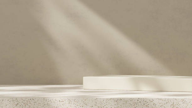 istock Empty mockup featuring a ceramic textured podium against a simple brown wall in a landscape layout 2192101390