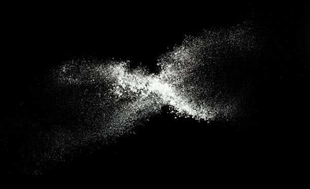 istock Fluffy White snow splash flying or throwing in mid air. Snowfall on Black background isolated. Snow dust element falling over dark night 2192101585