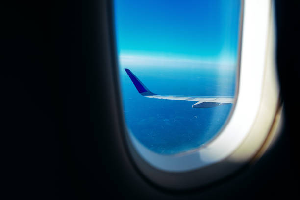 istock View from an airplane window showcasing a wing against sky 2192102509