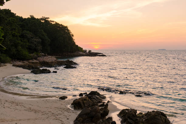 istock Serene sunset over Koh Munnork Island's tranquil shoreline in Rayong, Thailand 2192103476