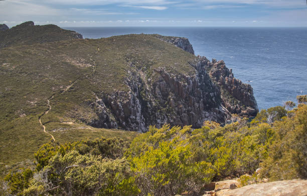 istock Breathtaking view of Cape Hauy Tasmania featuring rugged cliffs lush greenery and the vast ocean. Australia 2192106771