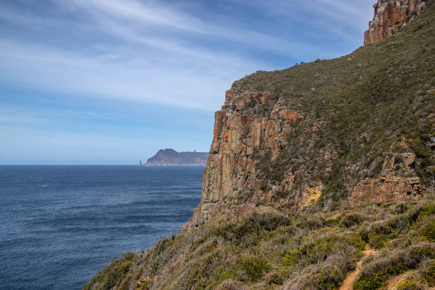 istock Breathtaking view of Cape Hauy Tasmania featuring rugged cliffs lush greenery and the vast ocean. Australia 2192107089