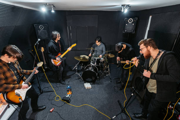 istock Rock Band Rehearsing In A Studio 2192112124