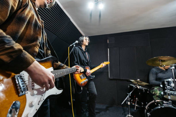 istock Rock Band Rehearsing In A Studio 2192112196