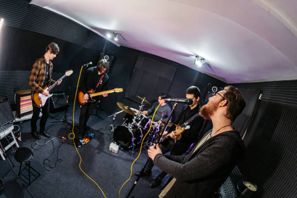 istock Rock Band Rehearsing In A Studio 2192112302