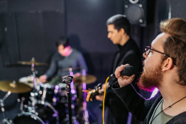 istock Rock Band Rehearsing In A Studio 2192112325