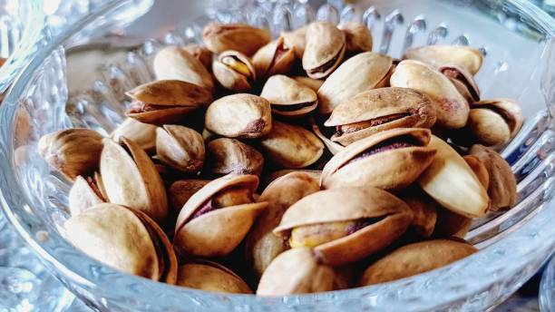 istock Healthy nuts in a bowl. Snack. 2192112472