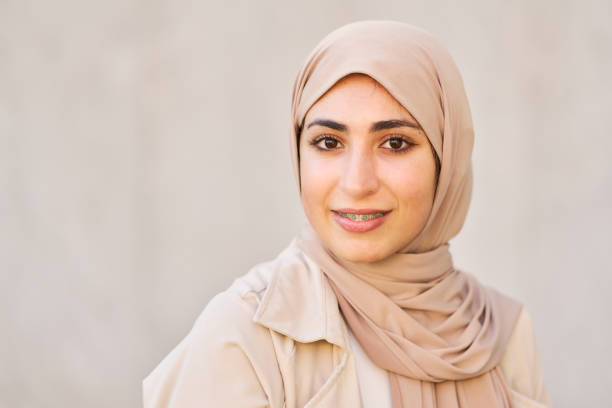 istock Young arab woman wearing hijab smiling at camera 2192118457