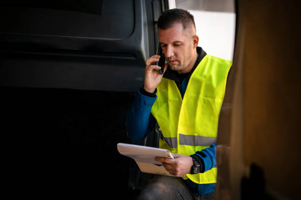 istock Delivery man talking on a phone 2192120899