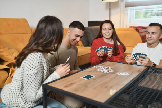 istock Handsome Male Laughing Looking Satisfied After Winning Another Round in Card Games 2192121721
