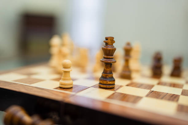 Intellectual game -chess. Wooden chess pieces on the chessboard