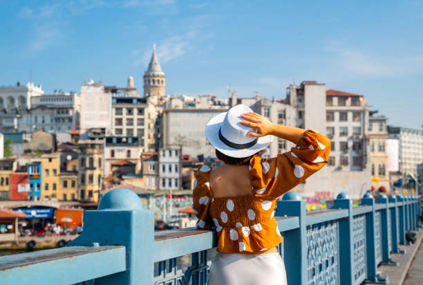 istock Young traveler woman posing on Galata Bridge, while exploring istanbul 2192126973