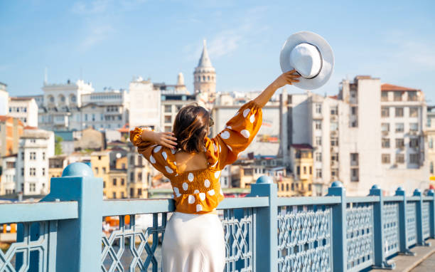 istock Young traveler woman posing on Galata Bridge, while exploring istanbul 2192126982