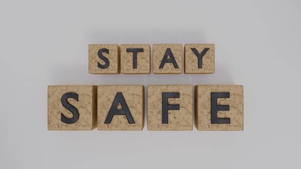 istock 3d render stay safe black color on the golden boxes with white background illustration banner 2192127847