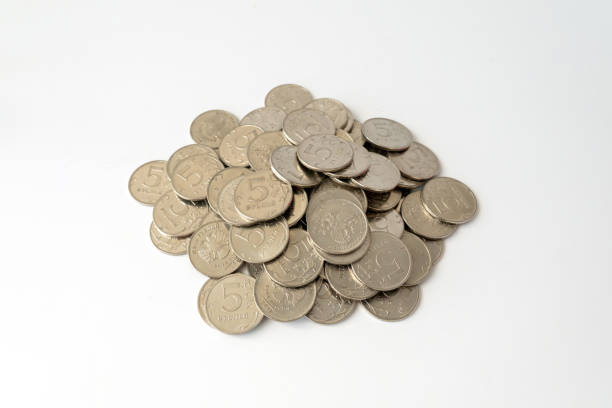 The Russian coin five rubles on a white background. five-ruble coins on a white table.