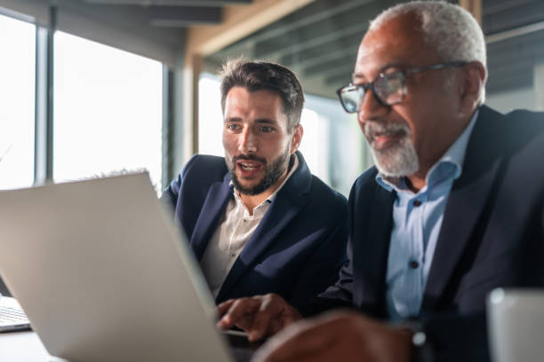 istock Diverse Business Executives Working on a Laptop in an Office Setting 2192130117