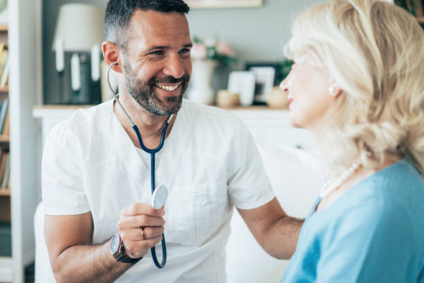 istock Doctor and a senior woman during home visit 2192130161