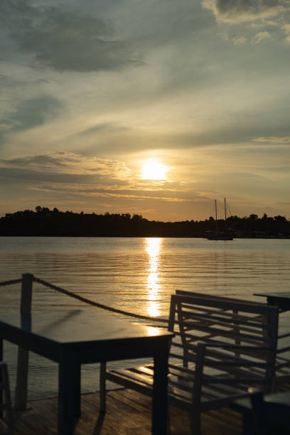 istock sunrise on the sea coast, cafe on the coast 2192132217
