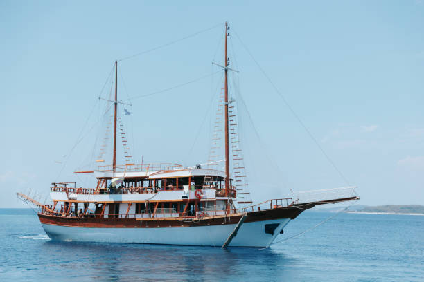 istock Large boat is sailing in the ocean with a blue sky in the background 2192132647