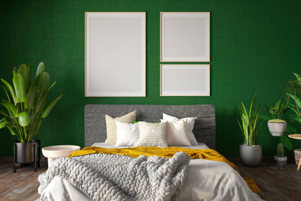 istock Empty Mock Up Picture Frames on Cozy Bedroom's Green Wall 2192134001