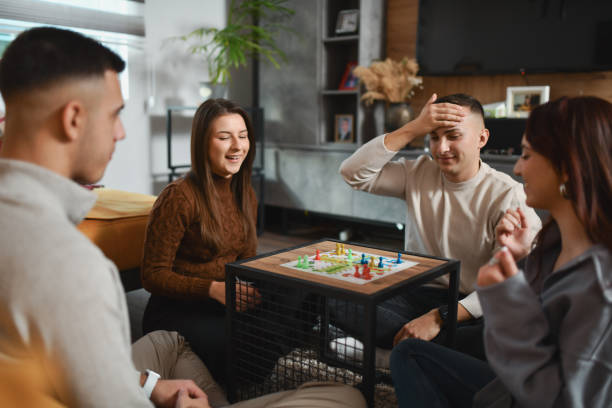 istock Handsome Male Player Holding His Forehead After Making Mistake in Board Game and Losing 2192134009