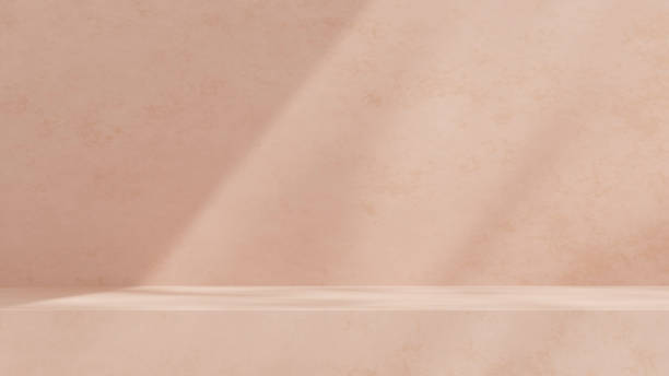 istock Empty mockup featuring a ceramic textured podium against a simple pink wall in a landscape layout 2192137118