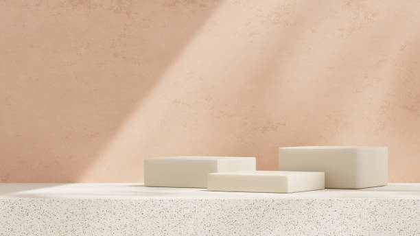 istock Empty mockup featuring a ceramic textured podium against a simple pink wall in a landscape layout 2192137120
