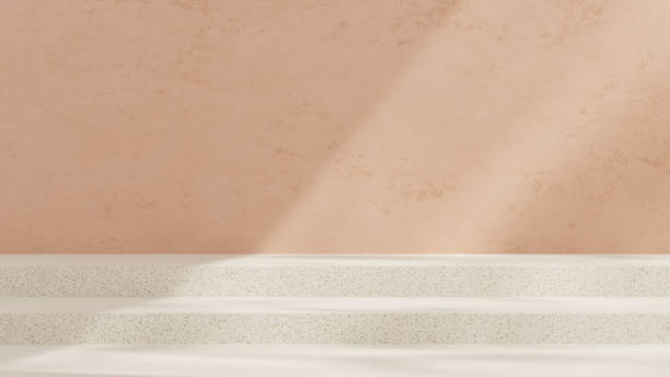 istock Empty mockup featuring a ceramic textured podium against a simple pink wall in a landscape layout 2192137131